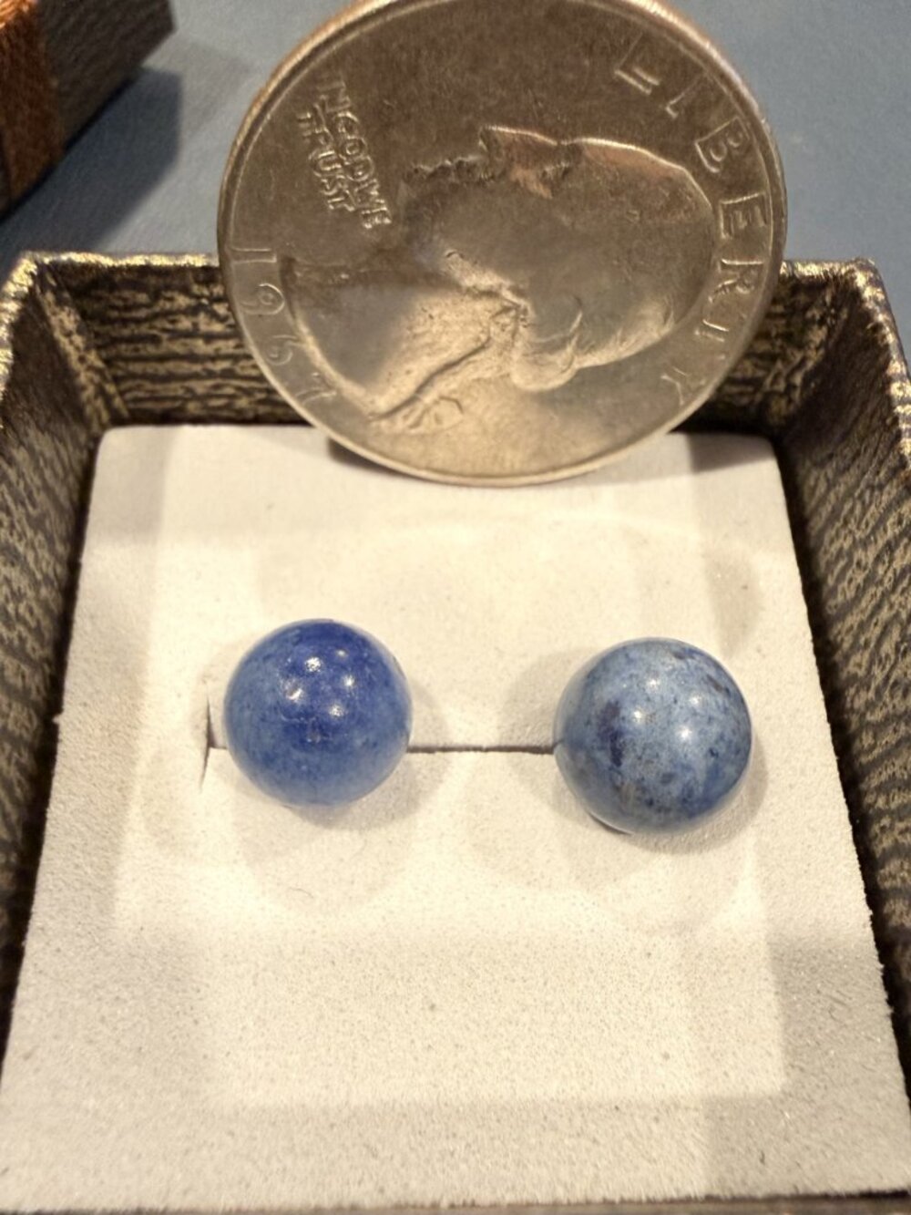 Beautiful 10K gold earrings with larger round blue stone.